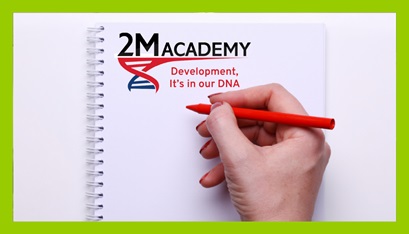 A notepad with 2M Academy branding